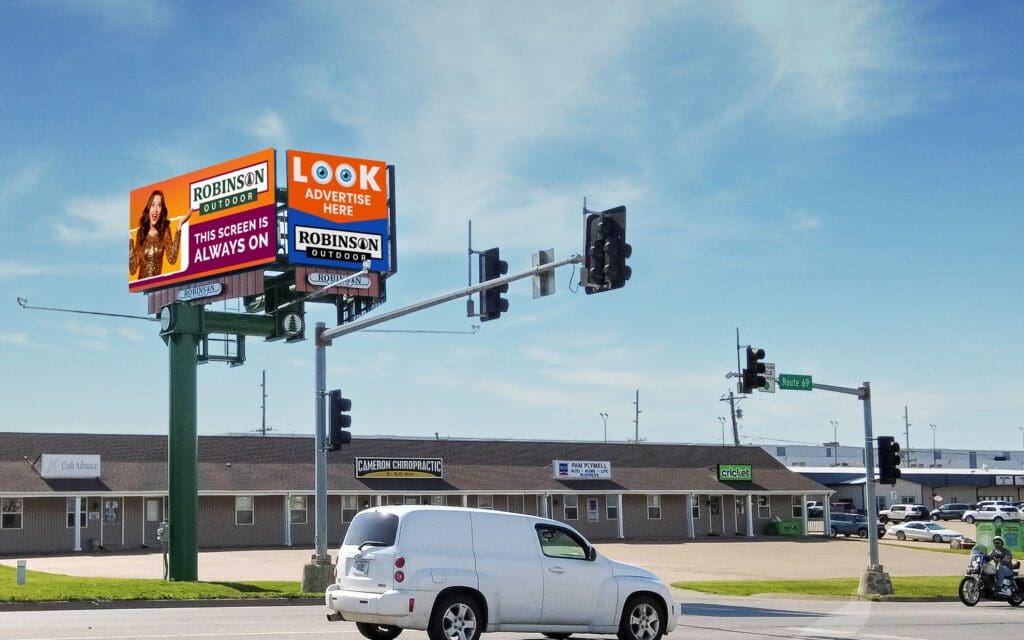 A white van is parked at the corner of an intersection.