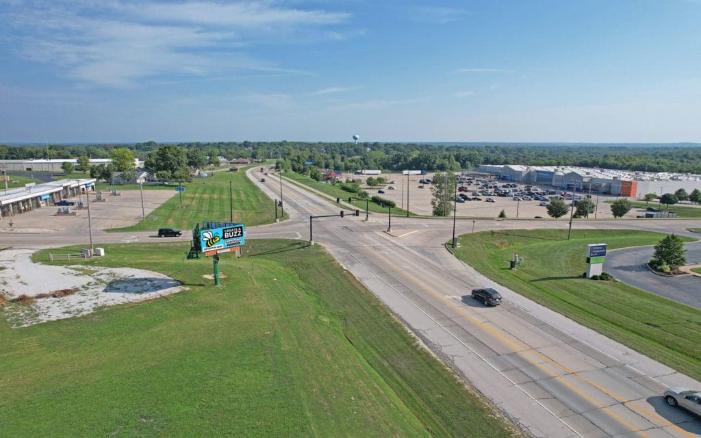 A road with some cars driving down it