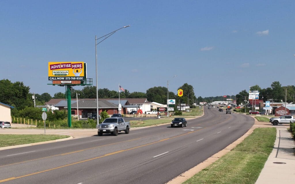 A street sign on the side of a road.