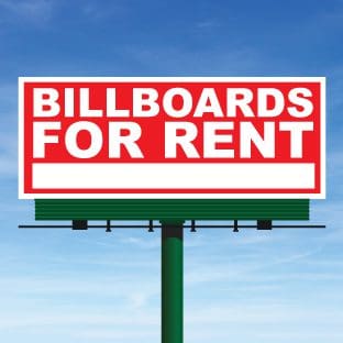 A billboard for rent on the side of a road.
