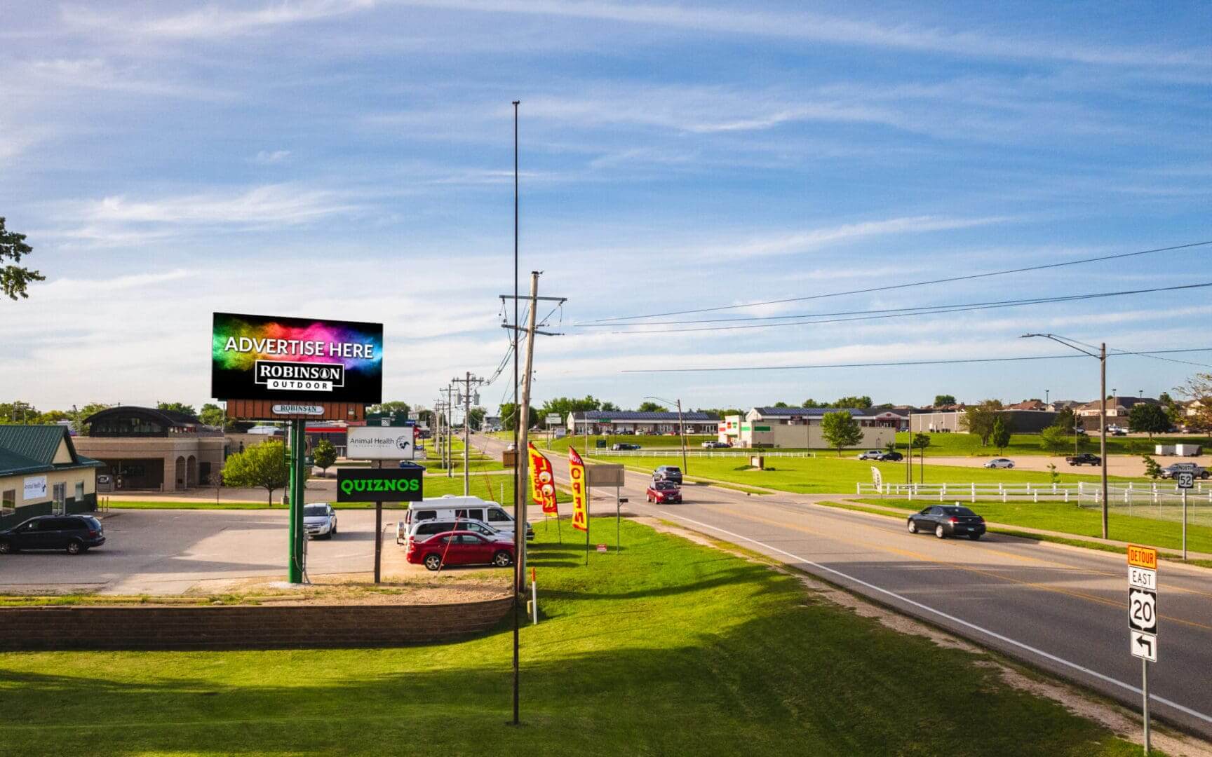 A view of a highway with cars driving on it.