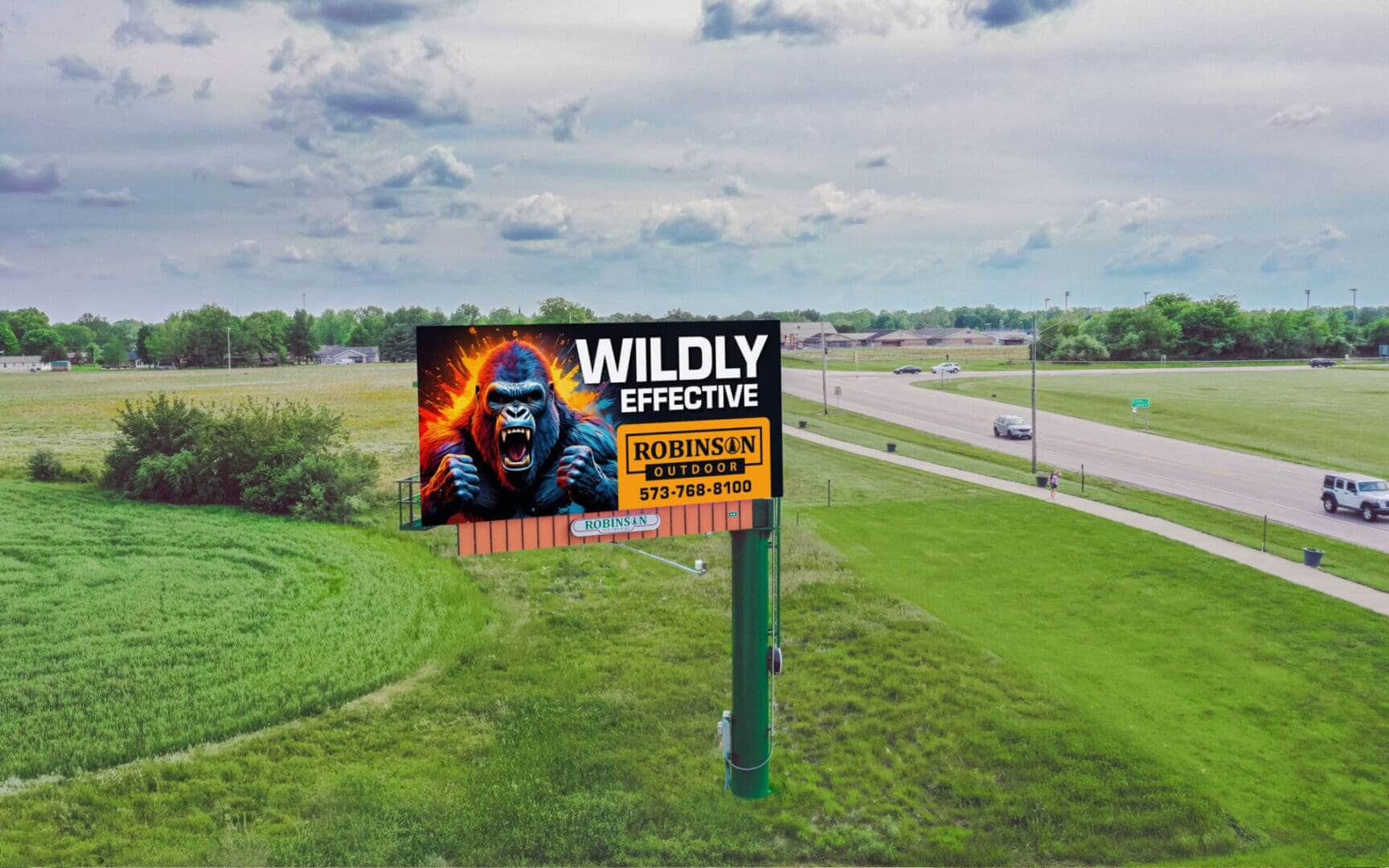 A billboard with a gorilla on it in the middle of nowhere.