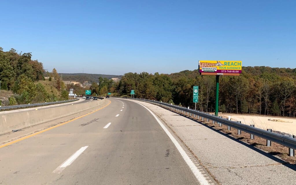A highway with many signs on the side of it.