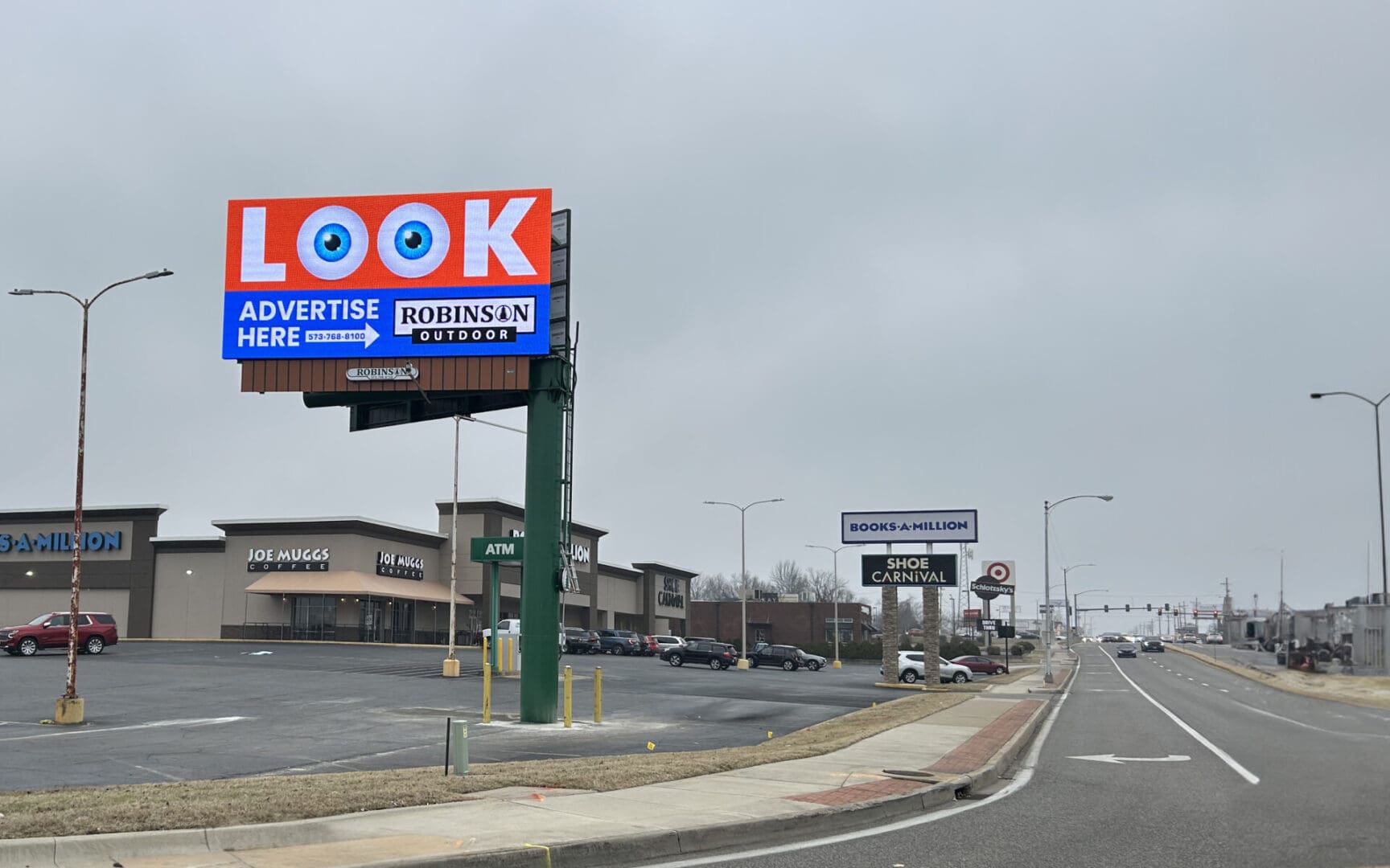 A large billboard on the side of a road.