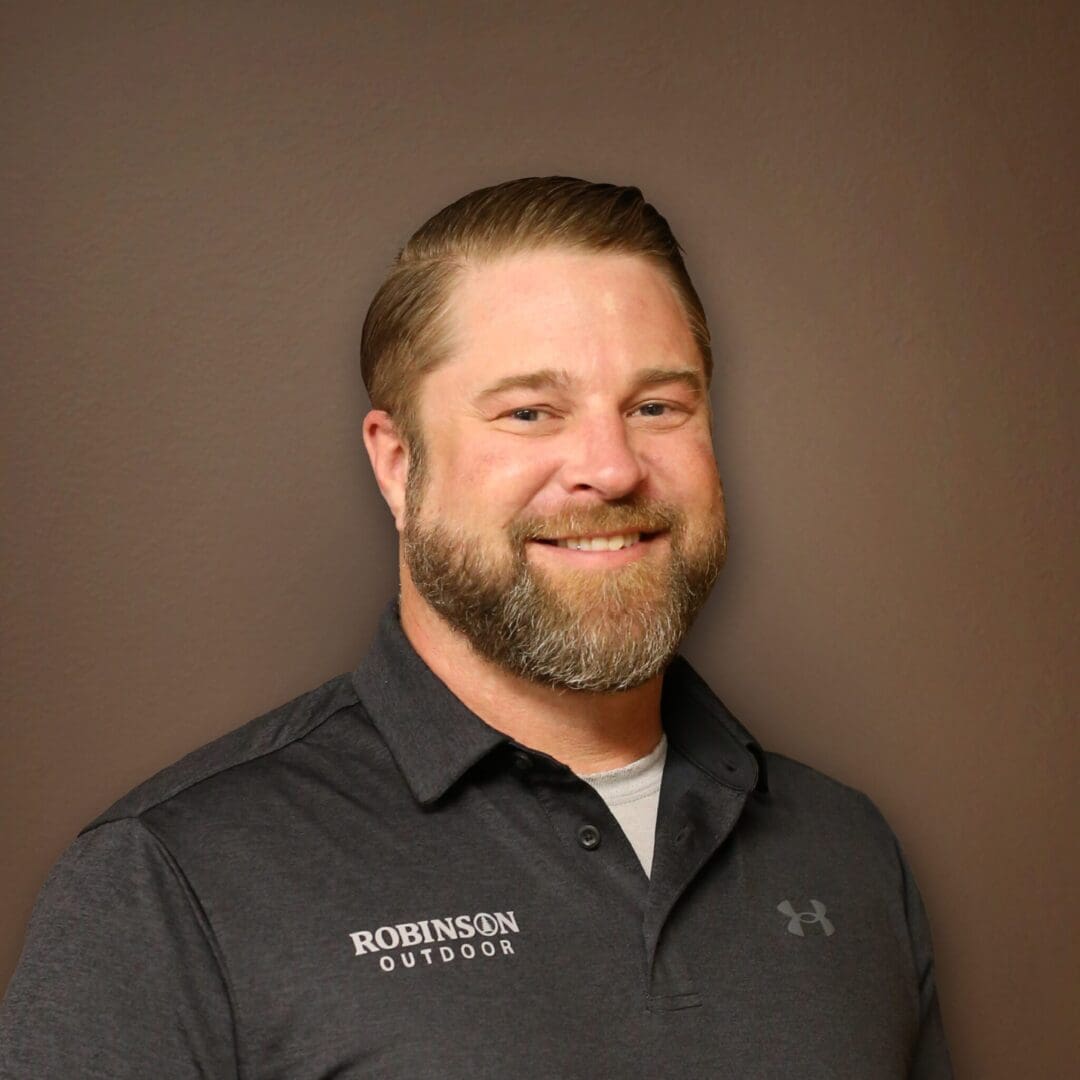 A man with a beard and mustache wearing a black shirt