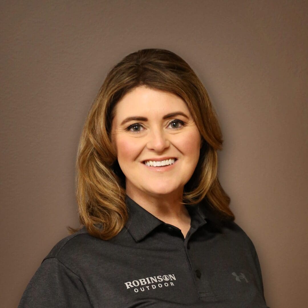 A woman in black shirt smiling for the camera.