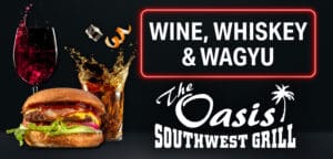 A black background with a glass of wine and some food.