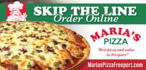 A pizza with many toppings on it