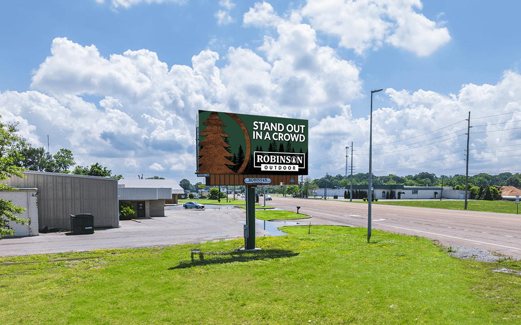 Billboard advertising Stand Out Landscaping against a blue sky.