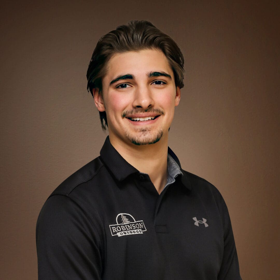 Smiling young man wearing black polo shirt