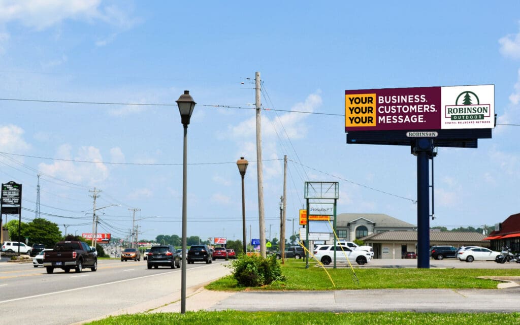 Large roadside billboard on busy street