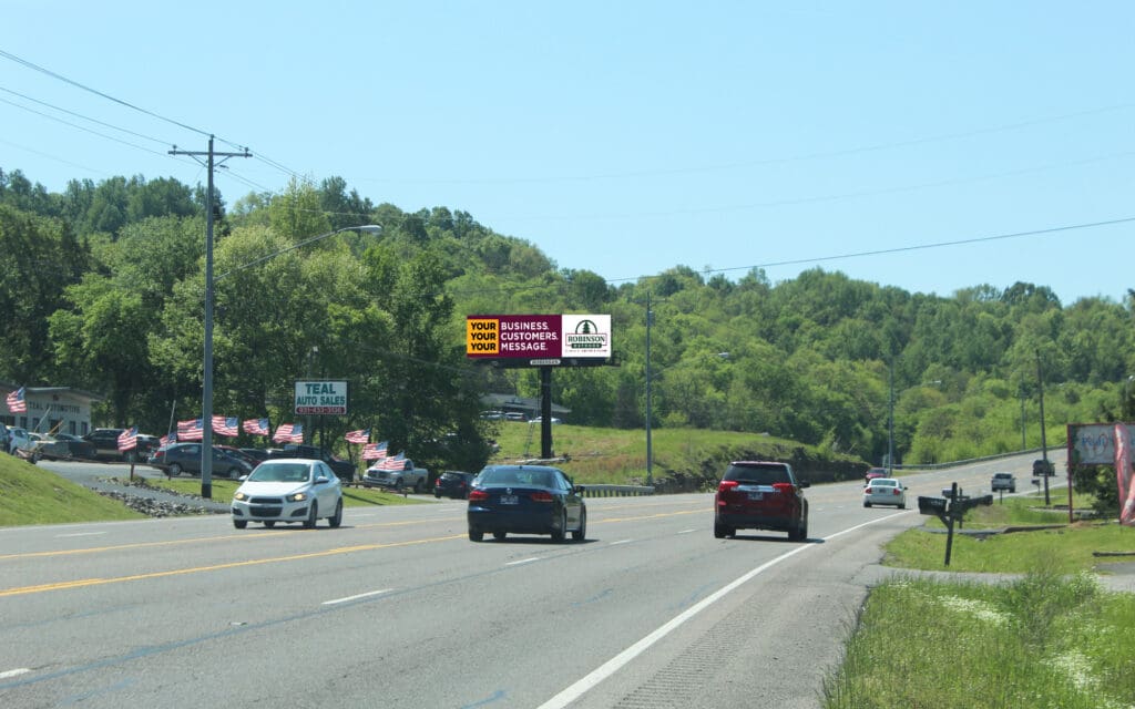Suburban highway with cars and billboard
