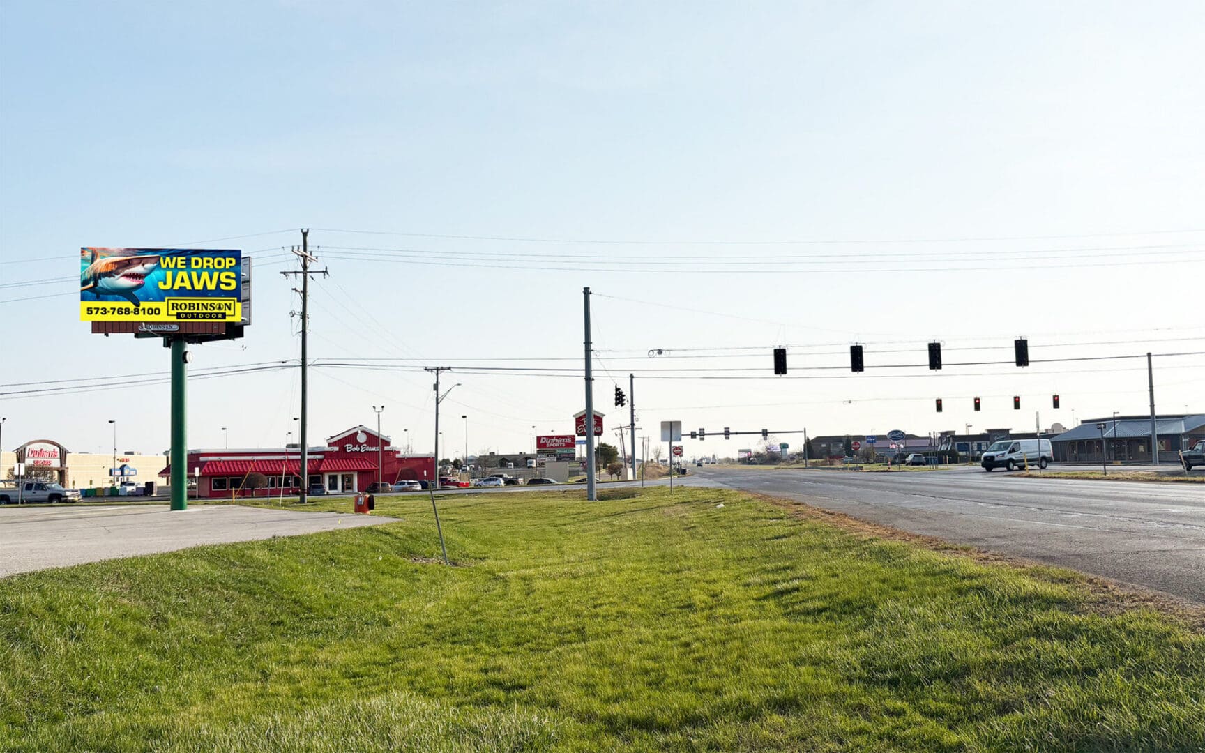 Suburban intersection with billboard and traffic lights