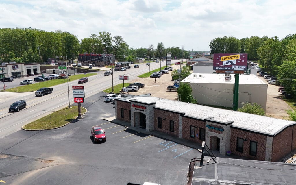Aerial view of strip mall and busy road