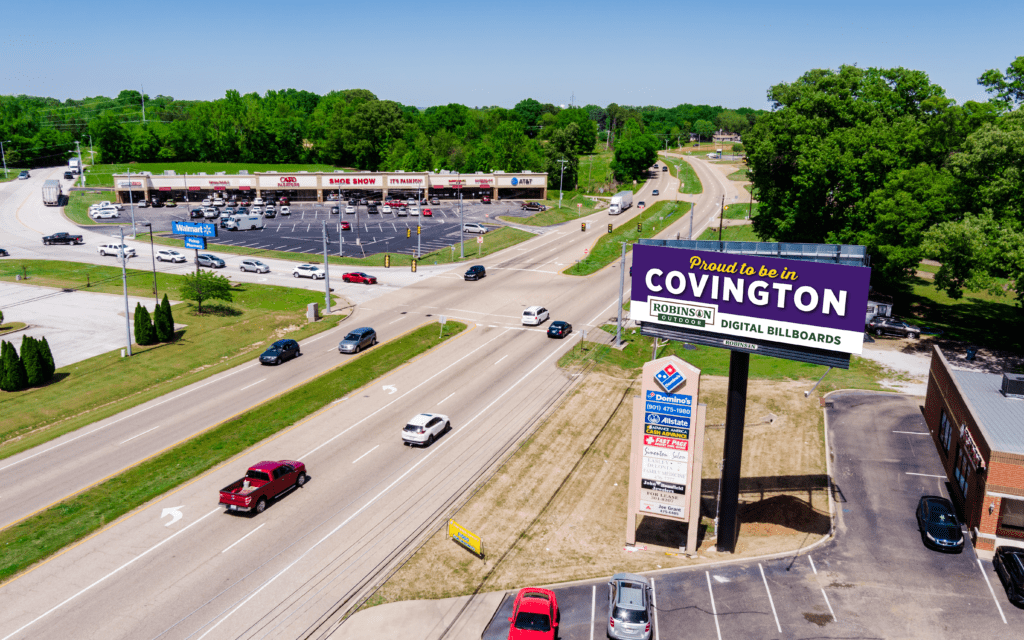 Aerial view of highway with Covington billboard
