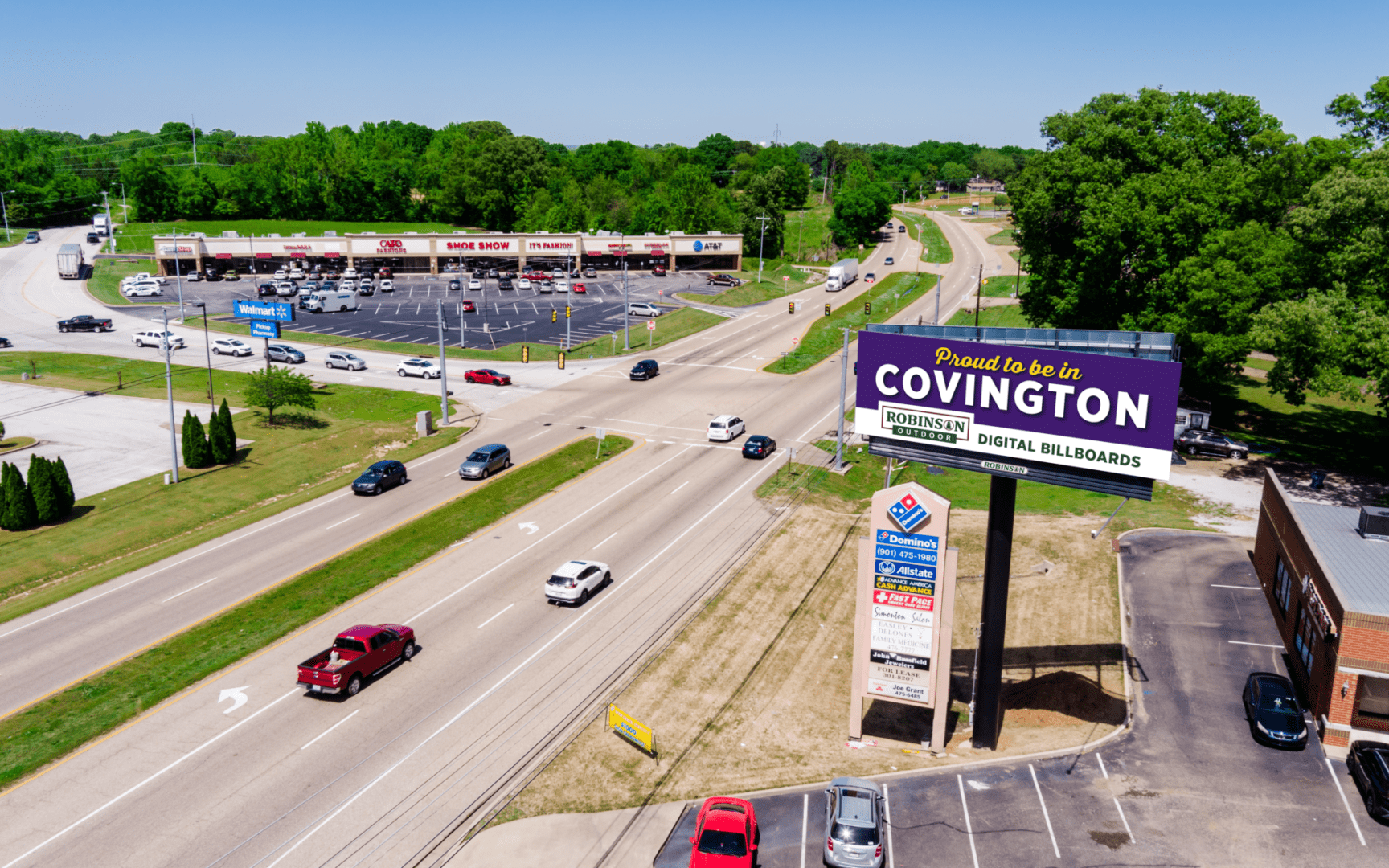 Aerial view of highway with Covington billboard