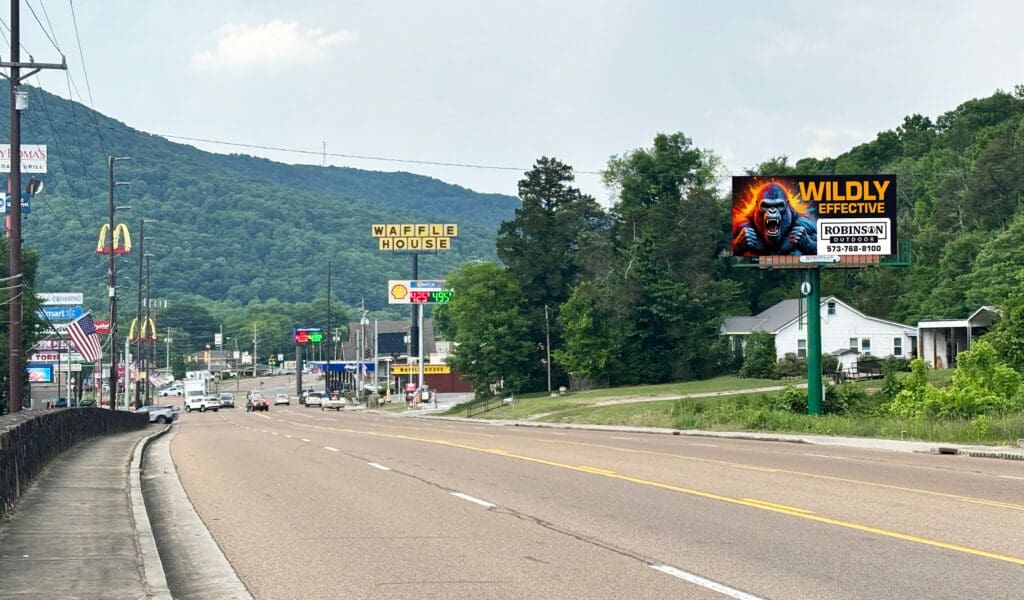 Small town highway with restaurants and billboard